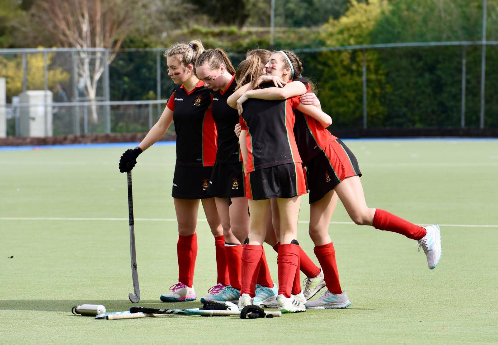 Senior Girls Hockey Team celebrating their win